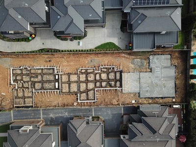 Aerial view of reinforcement and a poured concrete slab at a unit development